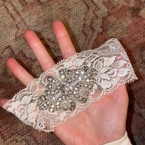 Rhinestone and lace garter belt for thigh